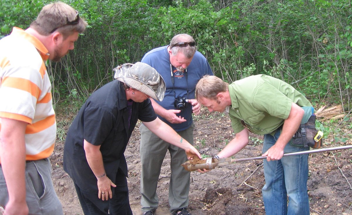 Soils class examining sediment core sample