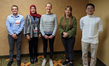 Photo of Elizabeth Boor and four other students at a conference.