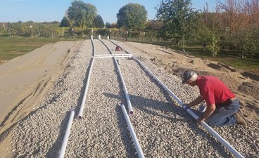 Pvc pipe assembly and installation in gravel