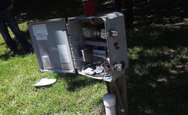 Opened septic system control box to reveal the inside